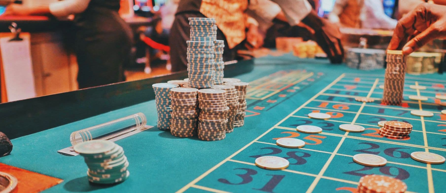 Image of casino chips on a roulette table
